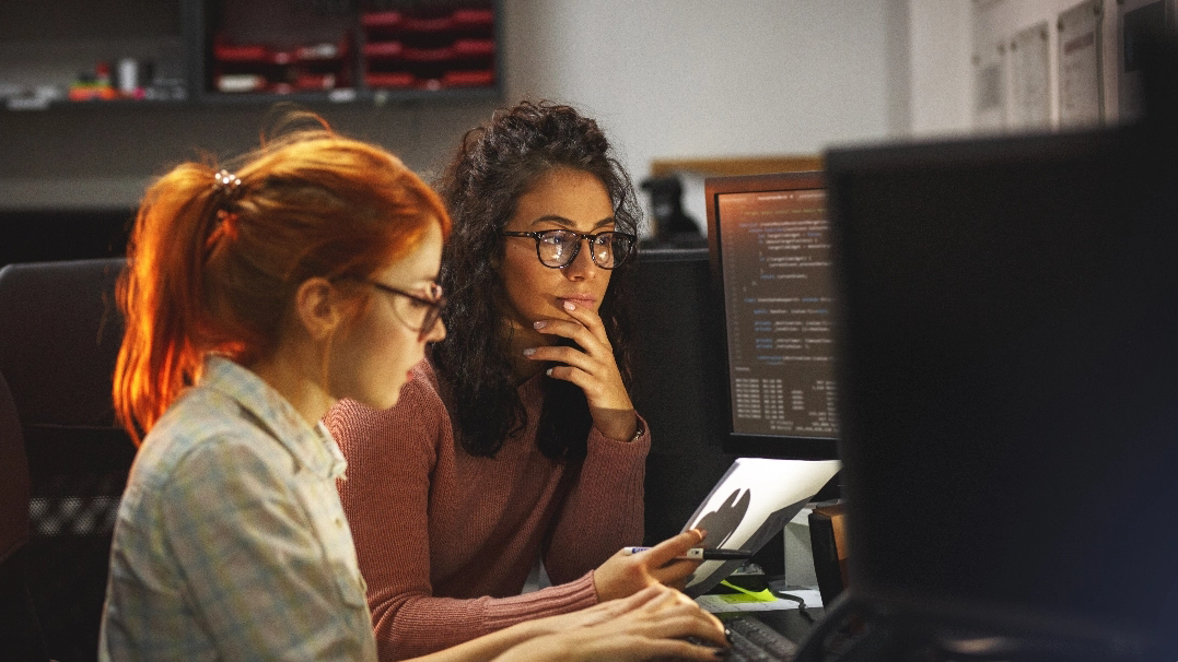 Two women in a focused discussion